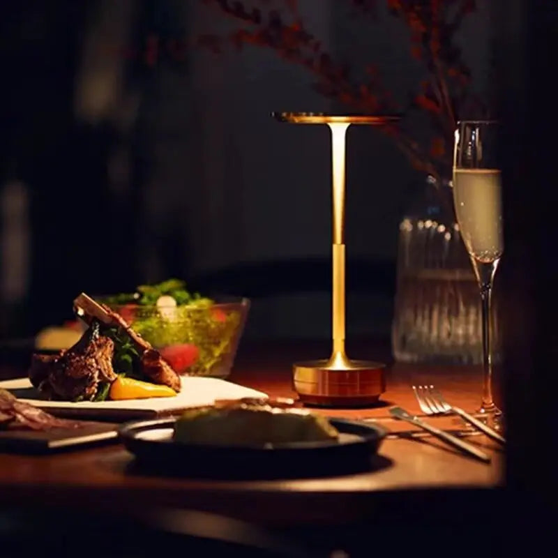 Sleek Cordless Table Lamp glowing on a dinner table beside a plated meal