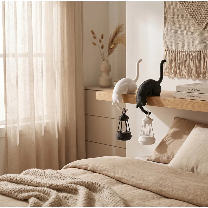 Gothic Cat Shelf Hook Figurines on a bedroom shelf with lanterns