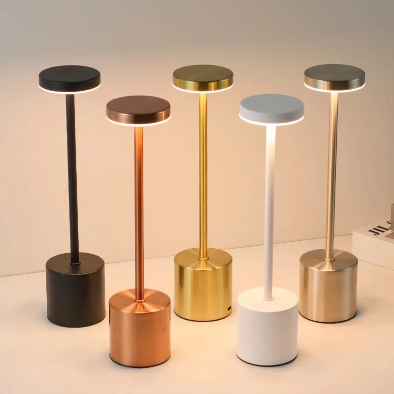 Touch Glow Cordless Desk Lamps in several metal finishes, all lit