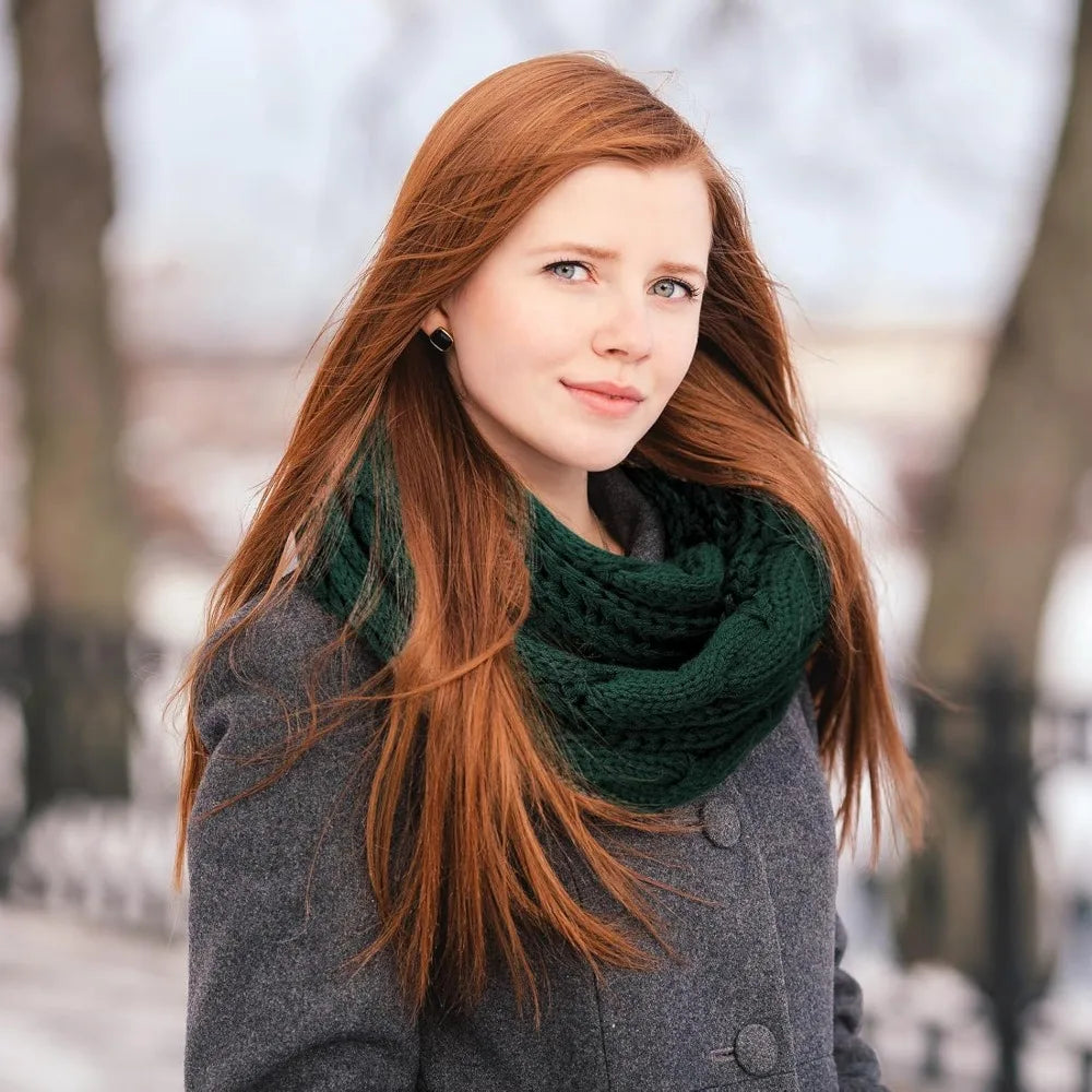 Woman wearing a green Cable Knit Loop Scarf outdoors