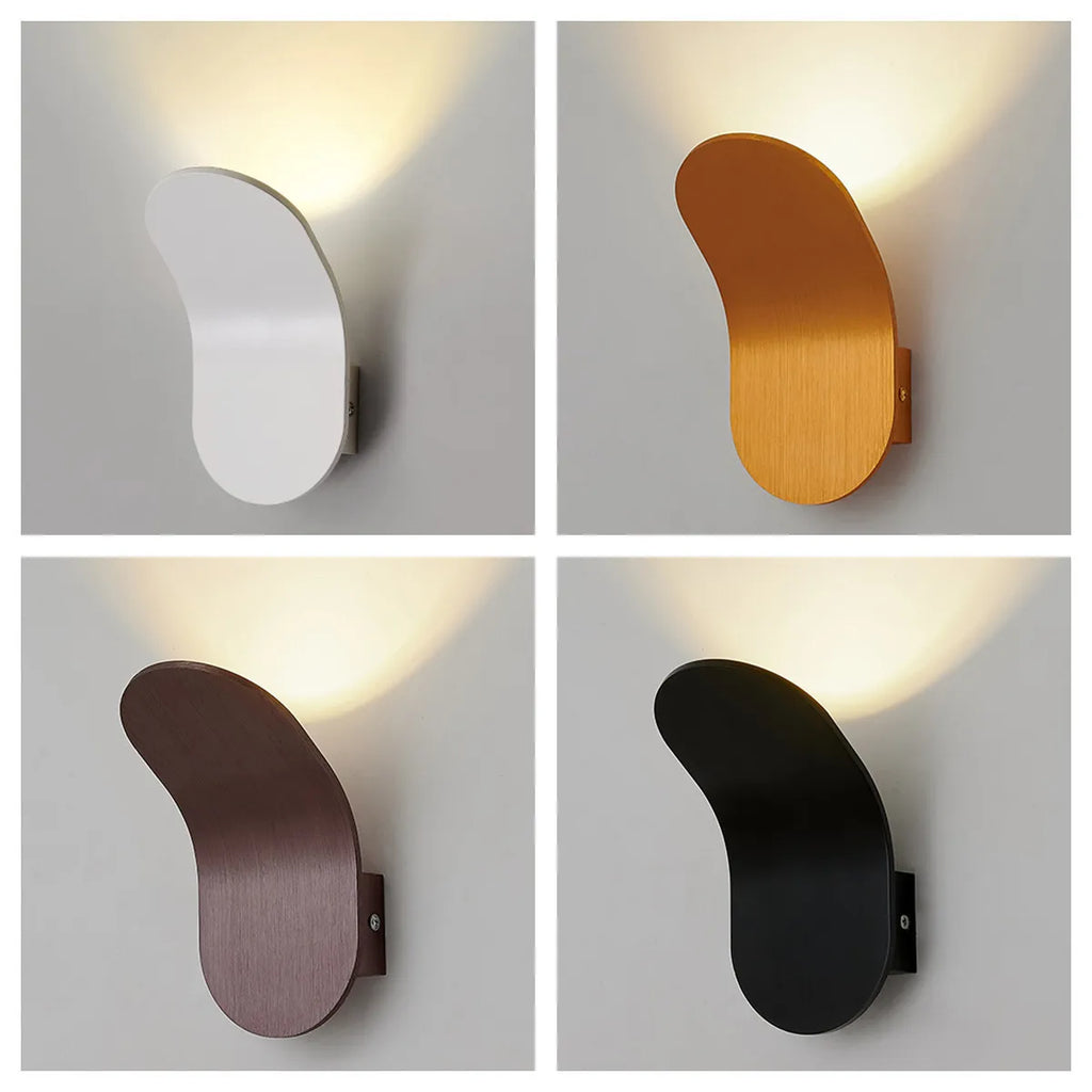 Nordic Glow Wall Lamp in four finishes, each casting an upward glow