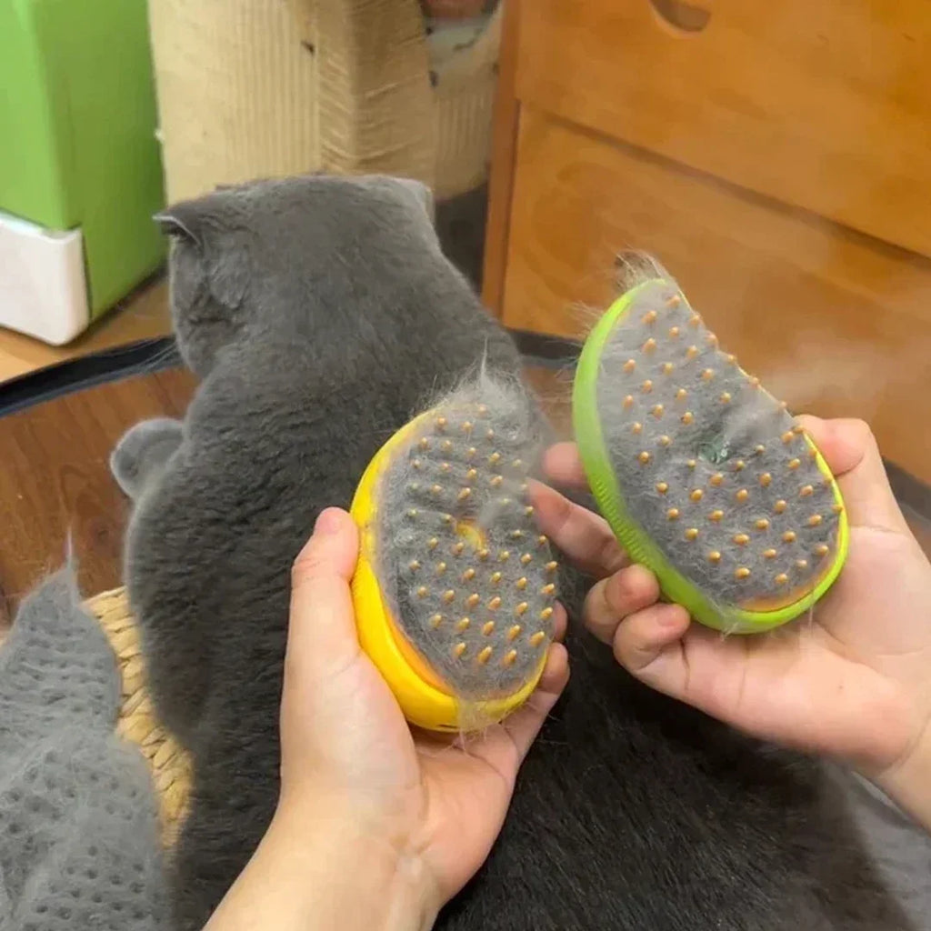 Two Pet Steam Grooming Brushes covered in loose cat hair after grooming