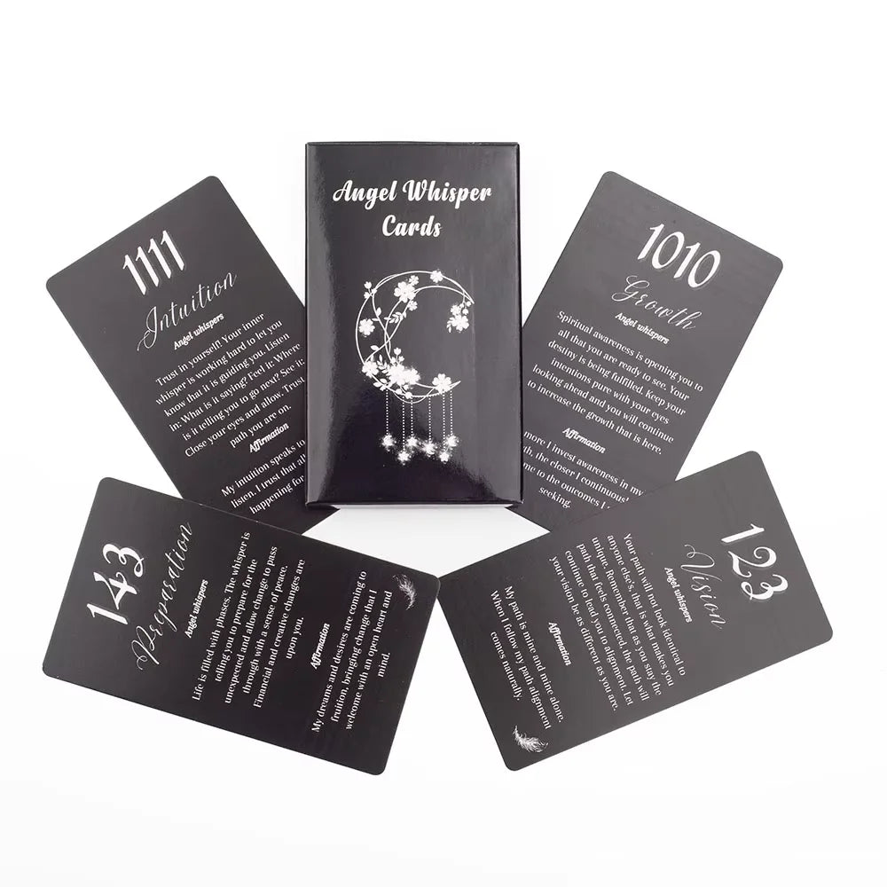 Angel Number Affirmation Cards fanned out, showing black and white card designs