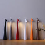 Row of Glow Tube Cordless Lamps in six colors, all switched on