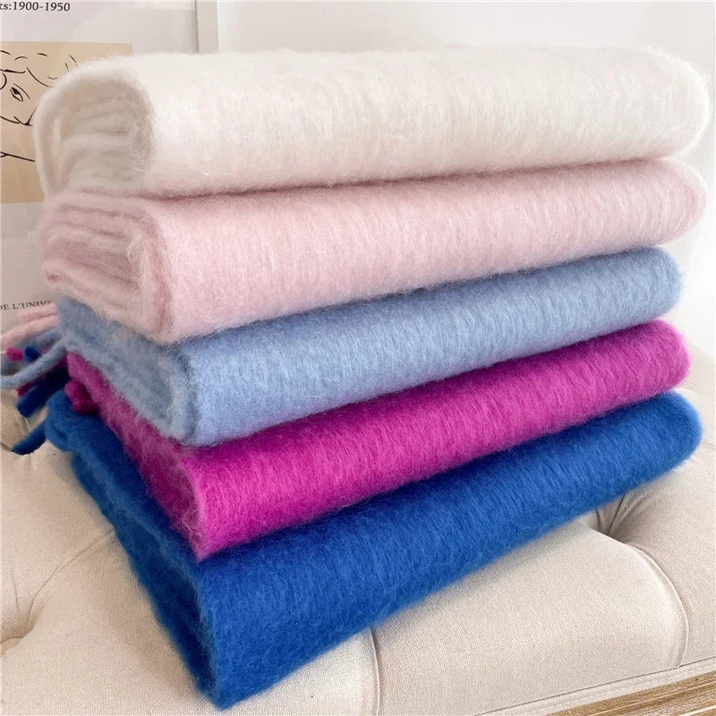 Folded stack of Tassel Pashmina Blanket Wraps in several colors