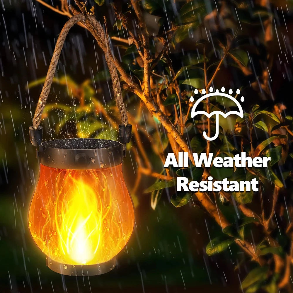 Solar Flickering Flame Lantern glowing in the rain