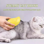 Brushing a white cat with the Pet Steam Grooming Brush