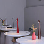 Glow Tube Cordless Lamps lighting cafe tables in a bright room