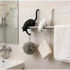 Gothic Cat Shelf Hook Figurines on a bathroom towel rail holding a loofah