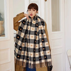 Woman wearing the Heart Plaid Blanket Scarf over a camel coat