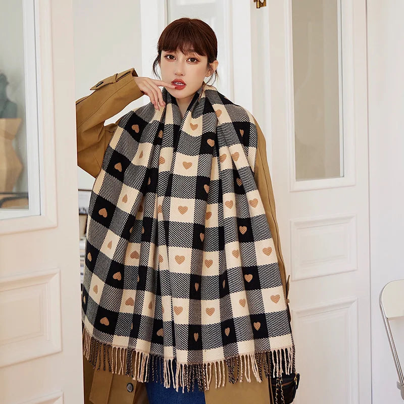 Woman wearing the Heart Plaid Blanket Scarf over a camel coat